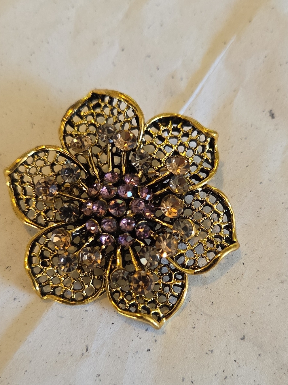 Gold Filigree Floral Brooch with Purple and Champagne Crystals